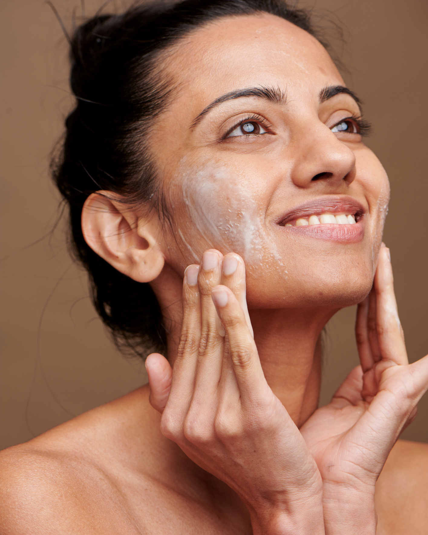 Woman Applying Skincare on Face